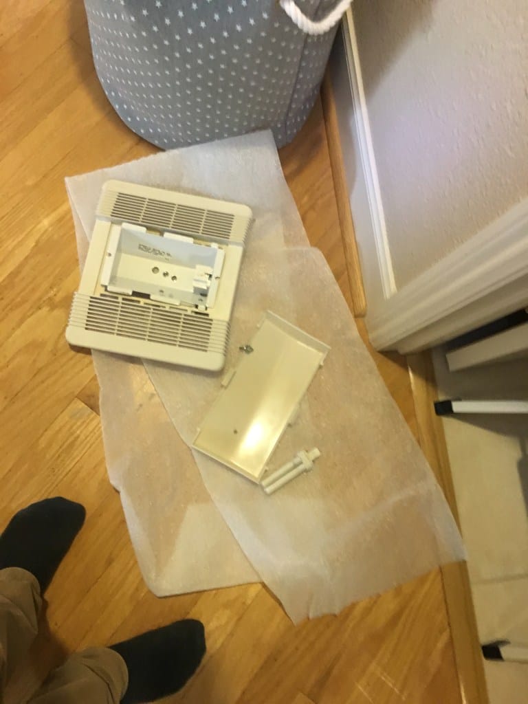 The grill, light cover, and light.